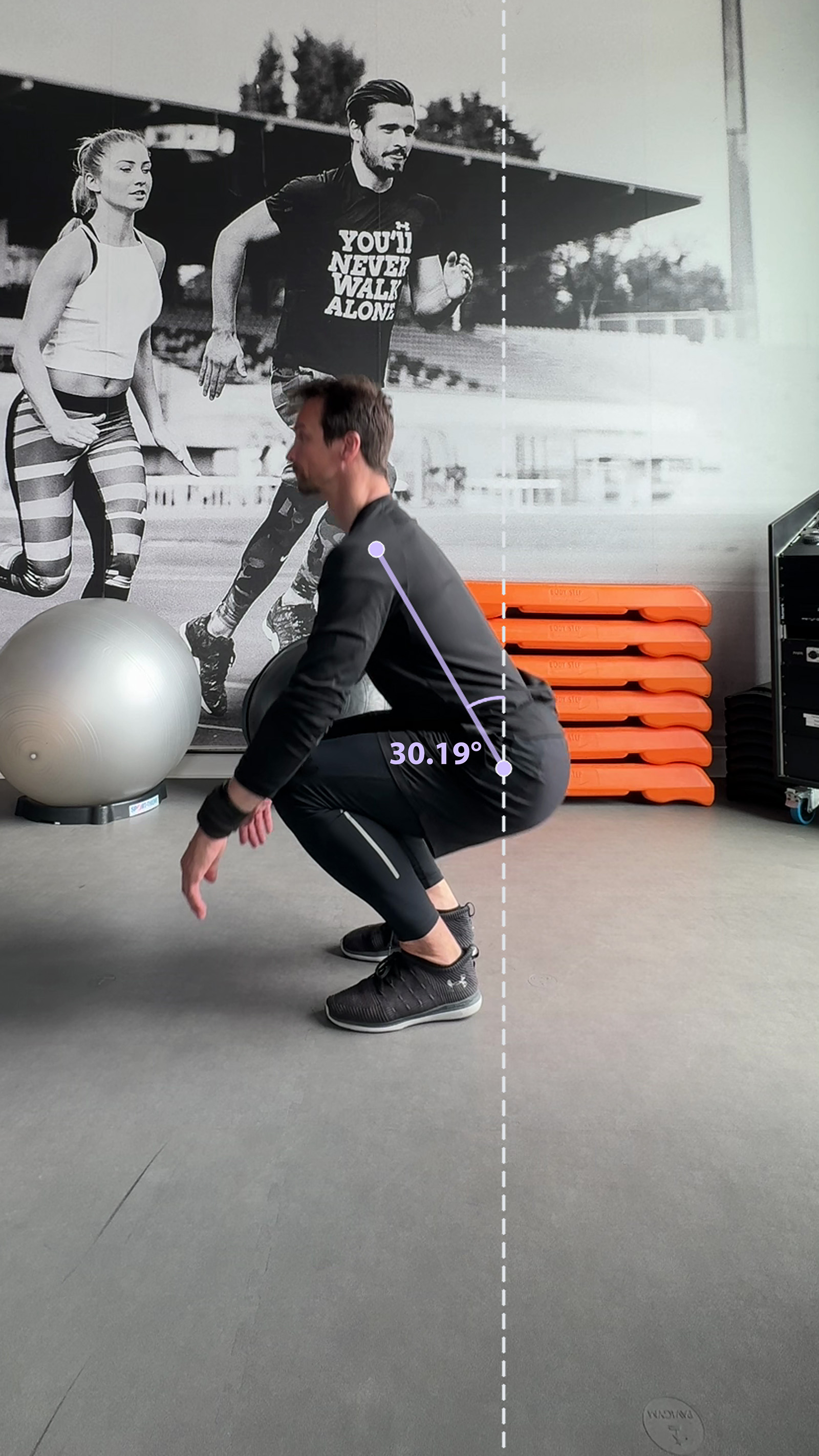 Sagittal deep squat frame showing a line from the hip to the shoulder and an angle of 30.19 degrees measured from the dashed image vertical.
